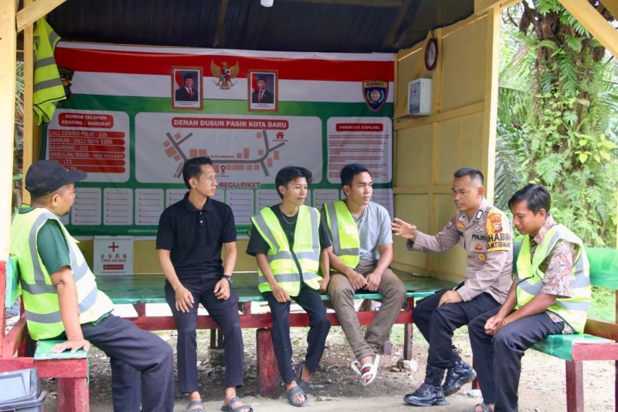 Bupati Ajak Seluruh Desa di Rohul Contoh Bhabinkamtibmas Koto Tinggi dalam Penguatan Satkamling